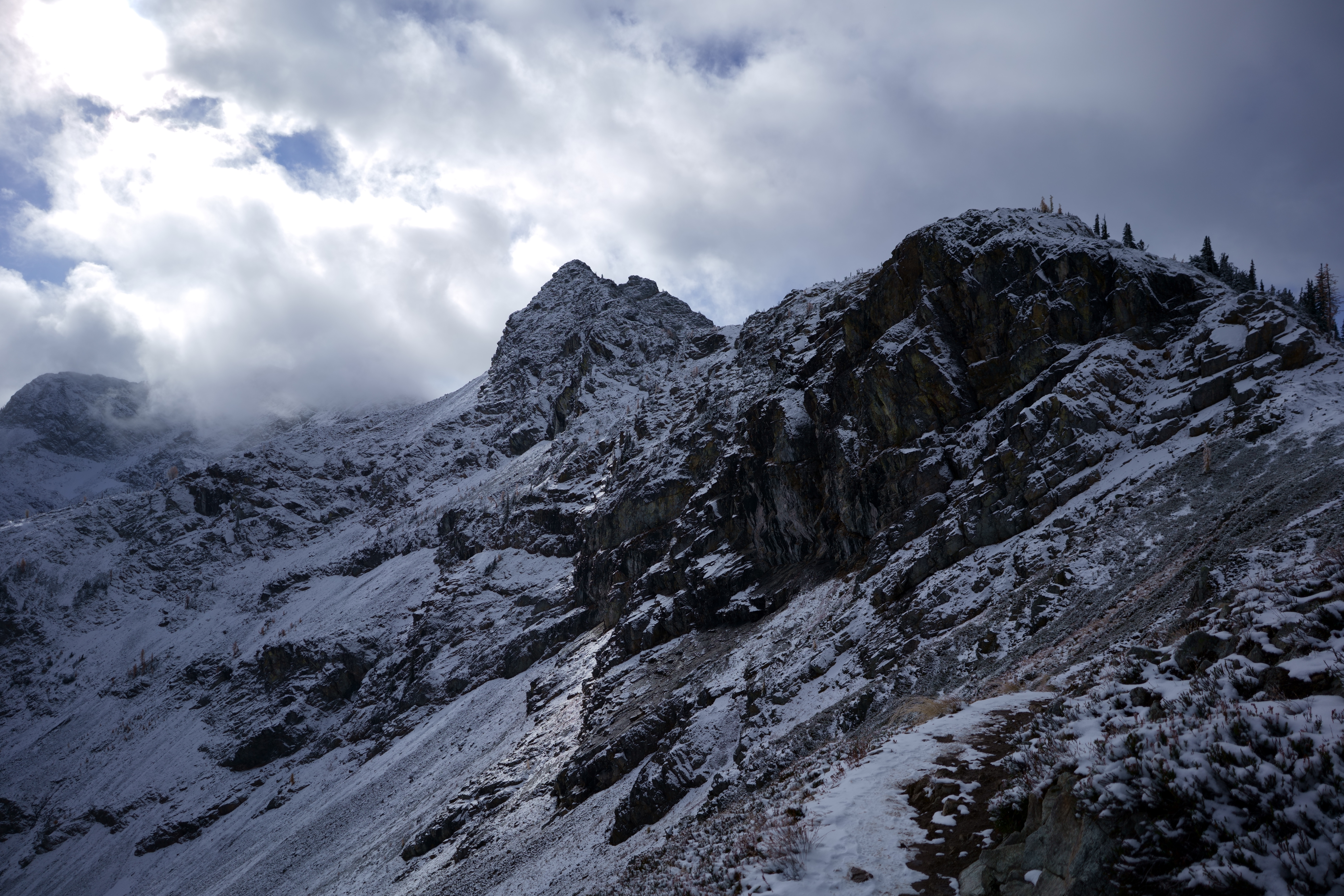 Image of snowy mountain peak from adjactent crest